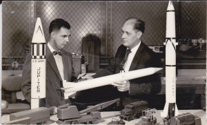 Rowling (with missile) talks to a colleague at Chrysler Missile.