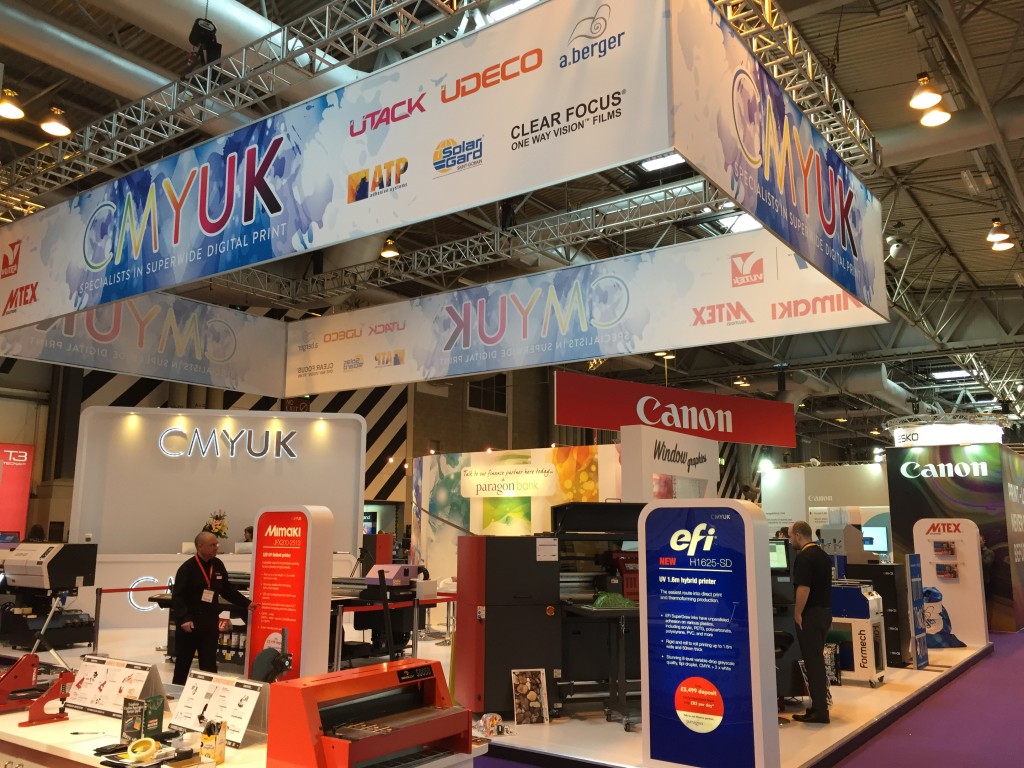 CMYUK booth showcasing Formech 300XQ and EFI H1625-SD printer